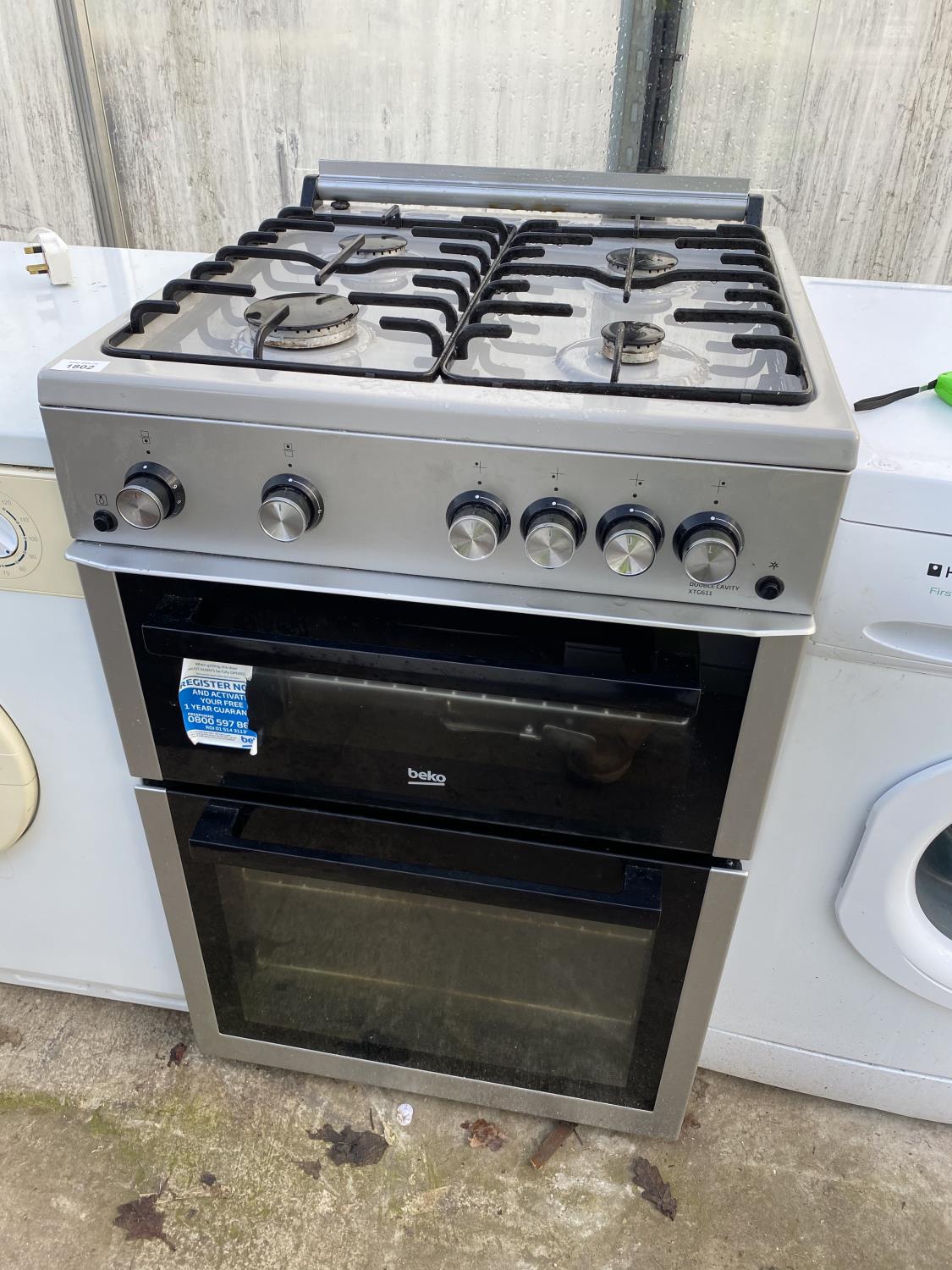 A SILVER BEKO GAS AND ELECTRIC FREESTANDING OVEN AND HOB BELIEVED WORKING OIRDER BUT NOI WARRANTY