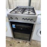 A SILVER BEKO GAS AND ELECTRIC FREESTANDING OVEN AND HOB BELIEVED WORKING OIRDER BUT NOI WARRANTY