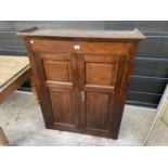 AN 18TH CENTURY OAK PANELLED TWO DOOR BOOKCASE TOP, THE BOTTOM SECTION WITH FITTED DRAWERS,