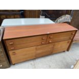 A RETRO STAG TEAK SIDEBOARD ENCLOSING FOUR DRAWERS AND CUPBOARDS, 60" WIDE