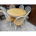 A CIRCULAR BEECH AND PAINTED EXTENDING DINING TABLE AND SIX MATCHING DINING CHAIRS