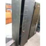 A LARGE SINGLE DOOR METAL CUPBOARD WITH THREE INTERNAL SHELVES