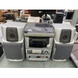 AN AIWA STEREO SYSTEM WITH TWO SPEAKERS IN W/O BUT NO WARRENTY