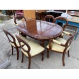 A VICTORIAN STYLE MAHOGANY WIND-OUT DINING TABLE WITH OVAL ENDS COMPLETE WITH TWO LEAVES, ON