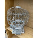 A VINTAGE AND ORNATE DECORATIVE BIRD CAGE