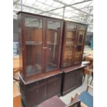 TWO STAG MINSTREL GLAZED TWO DOOR BOOKCASES WITH CUPBOARDS AND DRAWERS TO THE BASE