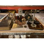 AN ECLECTIC ASSORTMENT OF ITEMS TO INCLUDE RELIGIOUS ITEMS, TWO CLOCKS, BRASS CANDLESTICKS ETC