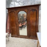 A VICTORIAN WALNUT TRIPLE WARDROBE WITH CENTRAL MIRROR DOOR, 83" WIDE