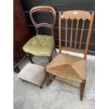 AN EARLY 20TH CENTURY OAK RUSH SEATED ROCKING CHAIR, VICTORIAN MAHOGANY DINING CHAIR AND A