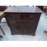 A GEORGE III OAK CHEST OF TWO SHORT AND THREE LONG DRAWERS ON BRACKET FEET, 38" WIDE