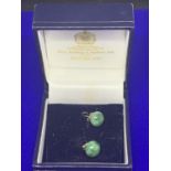 A PAIR OF JADE STUD EARRINGS SET IN 9 CARAT GOLD MARKED 375 IN A PRESENTATION BOX