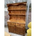 A MODERN PINE DRESSER WITH PLATE RACK, 43" WIDE