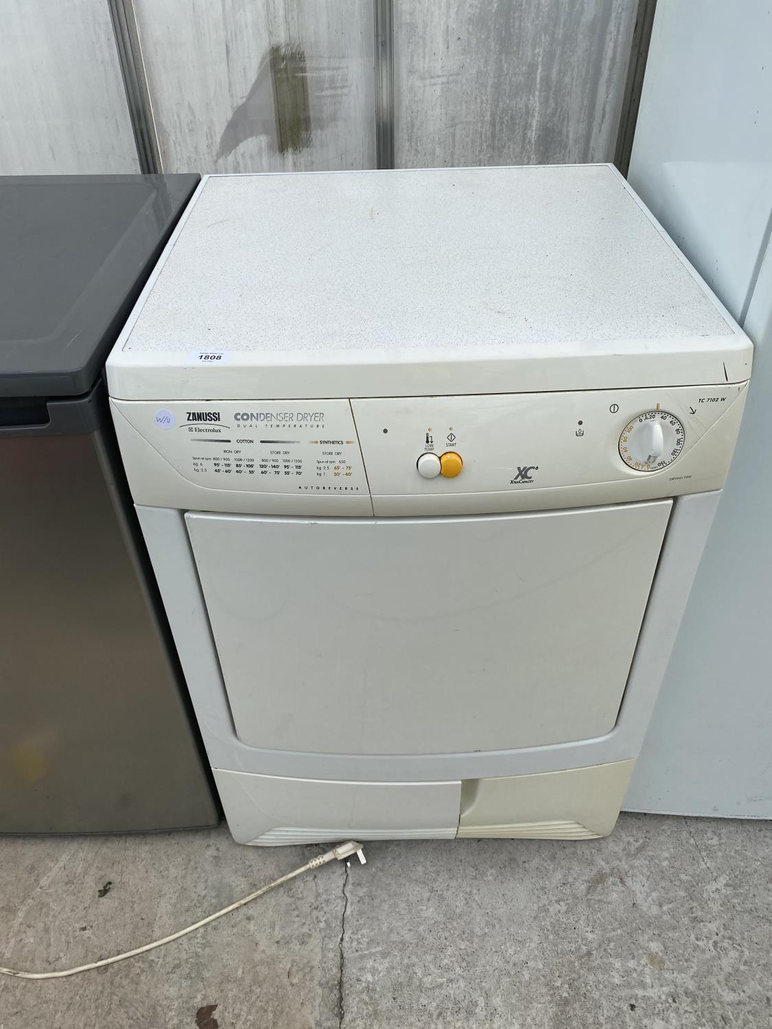 A WHITE ZANUSSI CONDENSER DRYER IN W/O BUT NO WARRENTY