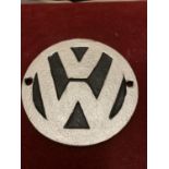 A CAST METAL "V.W VOLKSWAGEN" CIRCULAR SIGN