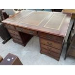A REPRODUCTION MAHOGANY TWIN PEDESTAL DESK ENCLOSING NINE DRAWERS AND INSET LEATHER TOP, 60x36"