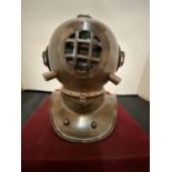 AN ORNAMENTAL COPPER DIVER'S HELMET