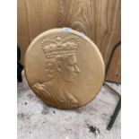 A WOODEN PLAQUE DEPICITING THE QUEENS HEAD COMPLETE WITH STAND