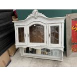 A 19TH CENTURY CONTINENTAL WALL CABINET WITH MIRRORED BACK AND THREE GLAZED DOORS
