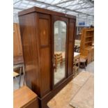 AN INLAID MAHOGANY WARDROBE WITH BEVEL EDGE MIRRORED DOOR AND LOWER DRAWER