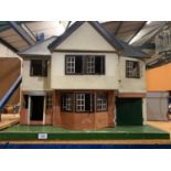 A LARGE VINTAGE DOLLSHOUSE