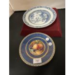 A HANDPAINTED WEDGWOOD PLAQUE SIGNED A HOLLAND - W669 AND AN ORIENTAL BLUE AND WHITE PLAQUE