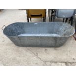 A LARGE STAINLESS STELL BATH TUB