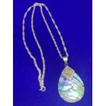 A SILVER CHAIN AND PENDANT MARKED 925 WITH A PEARLISED TEARDROP DESIGN