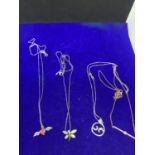 FOUR ASSORTED SILVER NECKLACES MARKED 925 WITH PENDANTS TO INCLUDE WINGS, BAR ETC