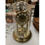 A BRASS HALLER DOMED MANTLE CLOCK