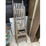 THREE SETS OF VINTAGE WOODEN LADDERS