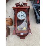 A DECORATIVE WOODEN WALL CLOCK WITH MECHANISM