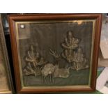 A WOODEN FRAMED EMBROIDERY OF A STAG AND A DOE IN PINE TREES