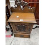 A LATE VICTORIAN MAHOGANY SINGLE CARVED DOOR WALL CABINET WITH SINGLE DRAWER