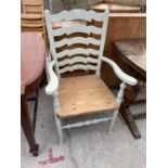 A PAINTED LADDERBACK ELBOW CHAIR WITH RUSH SEAT