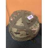 A BRITISH ARMY CAMOUFLAGE HELMET