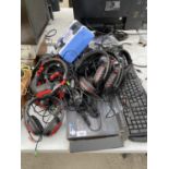 A LARGE COLLECTION OF COMPUTER ITEMS TO INCLUDE KEYBOARDS AND HEADPHONES ETC