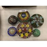 SIX DECORATIVE GLASS PAPERWEIGHTS OF VARIOUS SIZES
