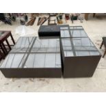 A MODERN BLACK ASH EFFECT LOUNGE TABLE AND TWO SMALLER MATCHING TABLES