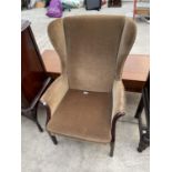 A PARKER KNOLL WINGED FIRESIDE CHAIR, MODEL PK.750