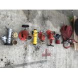 A QUANTITY OF FIRE HYDRANT FITTINGS AND A REEL OF FIRE HOSE