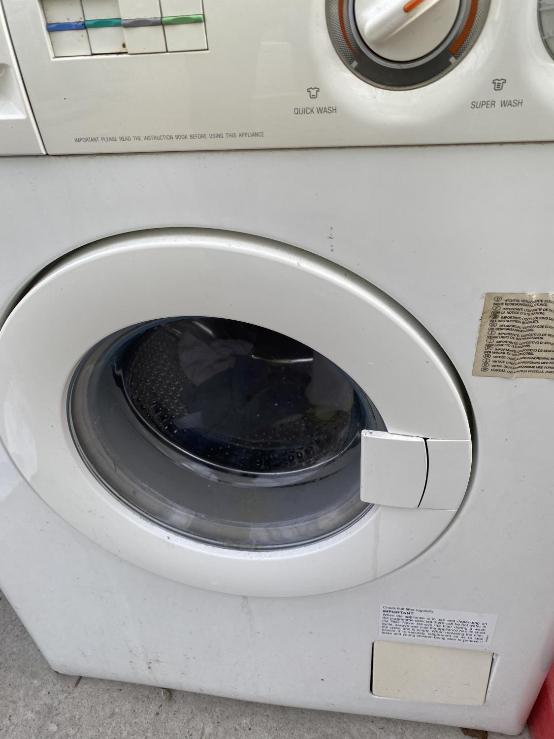 A WHITE ZANUSSI WASHING MACHINE BELIEVED IN WORKING ORDER BUT NO WARRANTY - Image 4 of 5