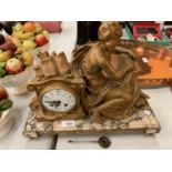 A SPELTER FIGURINE MANTLE CLOCK ON MARBLE BASE