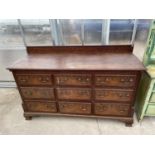 A GEORGE III OAK AND CROSSBANDED LANCASHIRE CHEST WITH FOUR SHAM DRAWERS, TWO BASE DRAWERS, ON