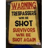 A METAL "WARNING TRESPASSERS WILL BE SHOT" SIGN