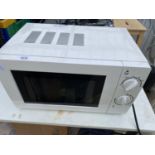 A WHITE GEORGE HOME MICROWAVE OVEN IN W/O BUT NO WARRENTY