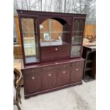 A MAHOGANY EFFECT CABINET WITH FOUR DOORS, FOUR DRAWERS AND TWO UPPER GLAZED DOORS