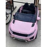 A PINK RAPID RACER ELECTRIC CHILDS CAR