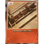 A PAPERBACK MUSIC BOOK CONTAINING SHEET MUSIC AND LYRICS FOR GUITAR AND RECORDER OF THE BEATLES