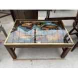 A RETRO COFFEE TABLE WITH ANCIENT MAP DESIGN AND BRASS SURROUNDS