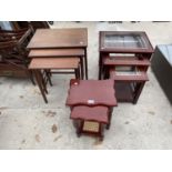 A TEAK NEST OF THREE TABLES, A MAHOGANY NEST OF THREE TABLES AND A MAHOGANY NEST OF TWO TABLES